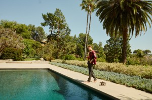 Jil Sander’s leather shirt jacket; Loewe’s silk shirt and sandals; Brioni’s wool and silk blend pants. David Yurman ring.