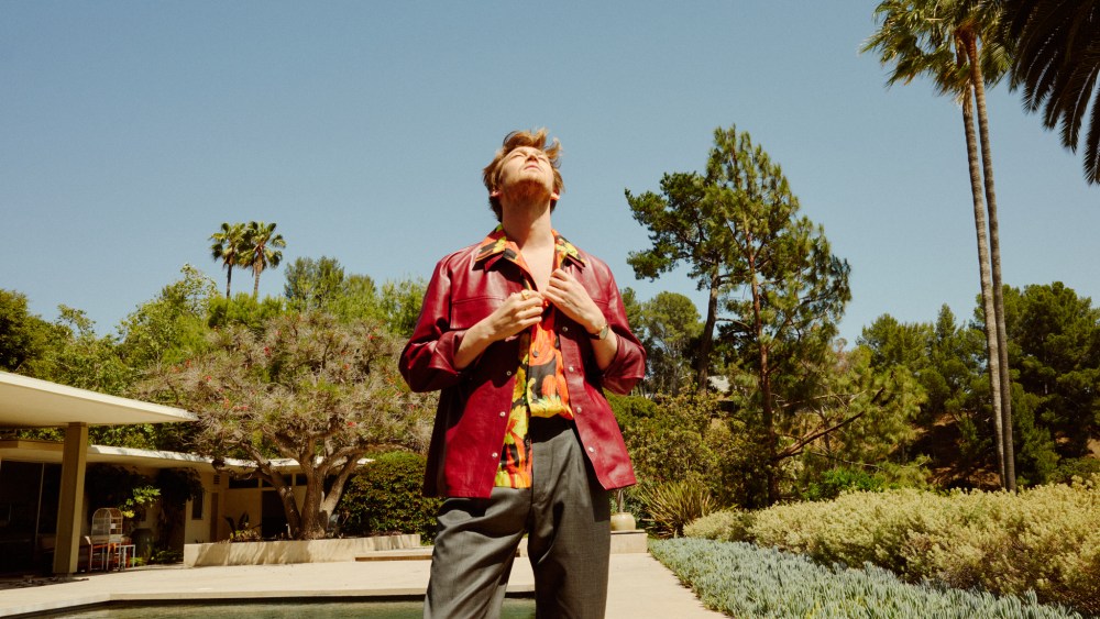 Jil Sander’s leather shirt jacket; Loewe’s silk shirt and sandals; Brioni’s wool and silk blend pants. David Yurman ring.