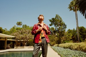 Jil Sander’s leather shirt jacket; Loewe’s silk shirt and sandals; Brioni’s wool and silk blend pants. David Yurman ring.