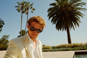 Canali’s linen jacket over Louis Vuitton Men’s silk shirt and Tom Ford’s viscose tank top; CDLP’s lyocell pants. Alwin’s own sunglasses; David Yurman ring.