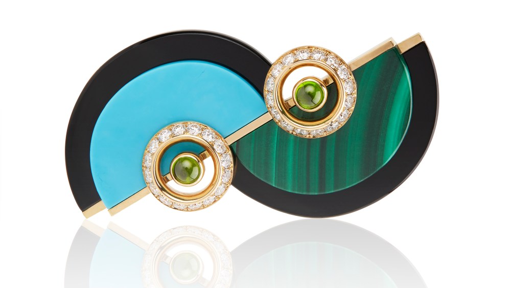A turquoise, onyx, malachite and peridot brooch by Kia Schwan.