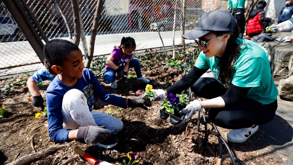 Volunteers from Macy’s work in partnership with Trust for Public Land at an event, Wednesday, April 13, 2022, in New York. (Jason DeCrow/AP Images for Macy’s)