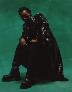 Egonlab’s sequin coat and Sacai’s polyester and wool suiting skirt. Rick Owens boots. Alexis Bittar Necklace. La rucci ring; left hand. ESTABLISHED Bottle Opener ring; right hand.
