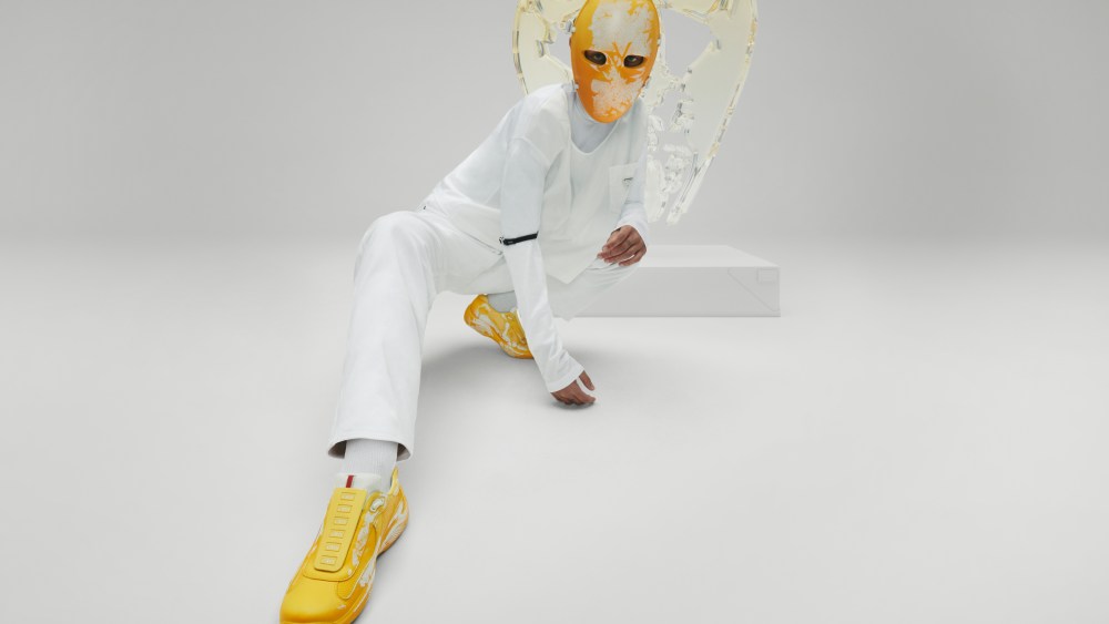 A campaign image of the Cass x Prada sneakers capsule.