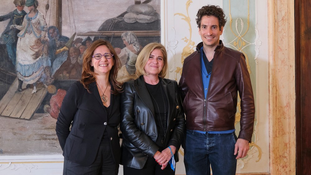 Left to right UNESCO's Francesca Santoro and Ana-Luiza M. Thompson-Flores with Prada Group's head of CSR Lorenzo Bertelli.