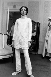 A model poses in a quilted and embellished tunic and pants from Valentino's spring 1968 haute couture "white collection" at the St. Regis Hotel in New York on March 11, 1968.