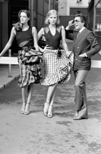 Valentino Garavani poses with models in his RTW Spring 1980 collection in Paris on October 9, 1979.