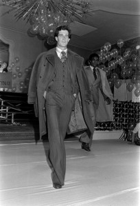 Models in Valentino menswear walk the runway during a benefit fashion show for the Special Olympics at the Hotel Pierre in New York City on June 7, 1976.