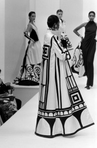Models pose on the runway in Valentino's Fall 1989 Couture evening coats and gowns inspired by Viennese architect Josef Hoffman.