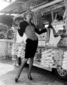 A model poses in an ensemble and accessories from the Valentino Fall 1992 Haute Couture collection.