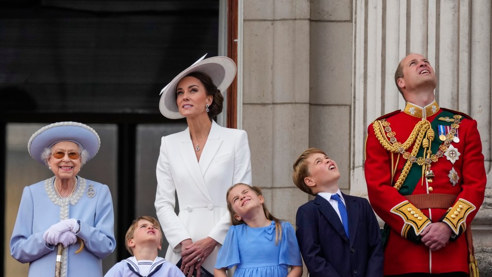 Queen Elizabeth II, from left, Prince Louis, Kate, Duchess of Cambridge, Princess Charlotte, Prince George and Prince William on the balcony of Buckingham Palace, London, Thursday June 2, 2022, on the first of four days of celebrations to mark the Platinum Jubilee. The events over a long holiday weekend in the U.K. are meant to celebrate the monarch's 70 years of service. (Alastair Grant/Pool Photo via AP)
