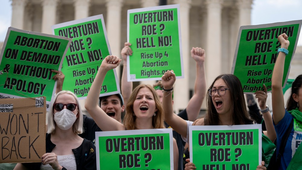 Abortion-rights protesters regroup and protest following Supreme Court's decision to overturn Roe v. Wade  in Washington, Friday, June 24, 2022. The Supreme Court has ended constitutional protections for abortion that had been in place nearly 50 years, a decision by its conservative majority to overturn the court's landmark abortion cases. (AP Photo/Gemunu Amarasinghe)