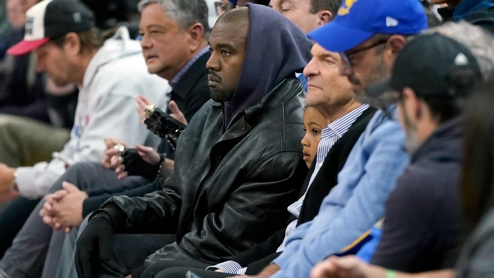 Kanye West posted on Instagram Monday accusing Adidas of selling a "fake Yeezy" slide