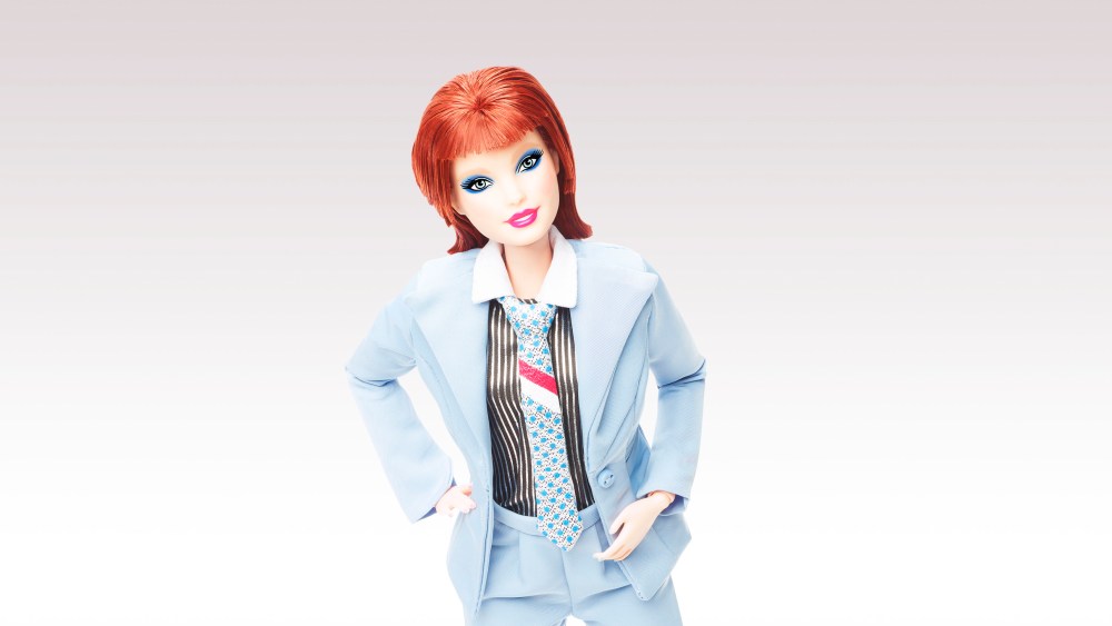 Barbie is paying tribute to music icon David Bowie with a new doll replicating his famous “Life on Mars” music video look. The second limited edition Barbie Signature Collection doll honouring the singer is being released to mark the 50th anniversary of the Hunky Dory album. Barbie Bowie wears the powder-blue suit from Bowie’s Life on Mars video from Hunky Dory, complimented by a foil-printed pinstripe shirt, a tie and platform shoes. The doll also has bold blue eyeshadow and a hairstyle inspired by Bowie’s 70s glam. Barbie first saluted Bowie three years ago by recreating his Ziggy Stardust alter-ego, complete with space suit and makeup. The David Bowie Barbie Doll 2 is available from MattelCreations.com priced at $50. BYLINE: Mattel/Mega. 29 Jun 2022 Pictured: Barbie pays tribute to music icon David Bowie with a new doll replicating his famous “Life on Mars” music video look. *BYLINE: Mattel/Mega. Photo credit: Mattel/Mega TheMegaAgency.com +1 888 505 6342 (Mega Agency TagID: MEGA873361_001.jpg) [Photo via Mega Agency]