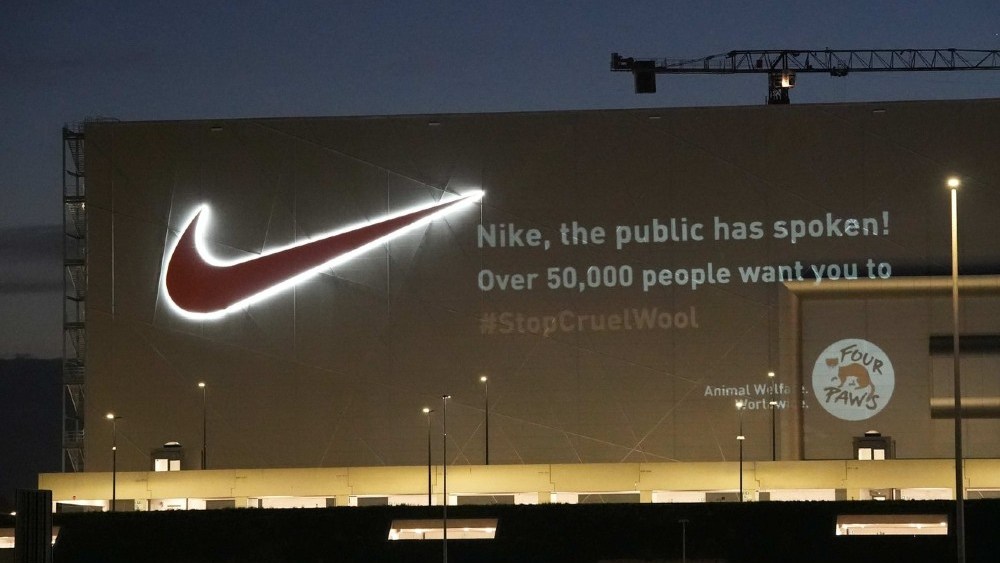 Four Paws its mulesing-free demands on the facade of a Nike facility in Belgium