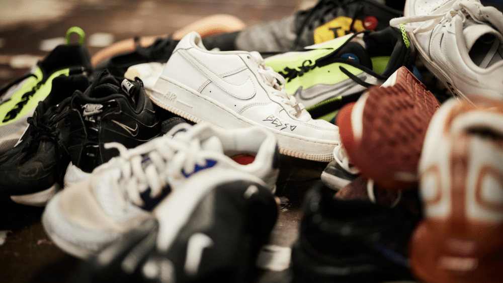 A warehouse manager for delivery carrier LaserShip has been charged with felony larceny by employee for stealing 11 pairs of Nike sneakers.