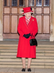 WINDSOR, ENGLAND - DECEMBER 08:  Queen Elizabeth II waist to thank local volunteers and key workers for the work they are doing during the coronavirus pandemic and over Christmas in the quadrangle of Windsor Castle on December 8, 2020 in Windsor, England (Photo by Pool/Samir Hussein/WireImage)