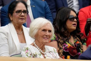Television personality Mary Berry, center, takes her seat on Centre Court to watch Britain's Katie Boulter and Karolina Pliskova of the Czech Republic play in a second round women's singles match on day four of the Wimbledon tennis championships in London, Thursday, June 30, 2022. (AP Photo/Kirsty Wigglesworth)
