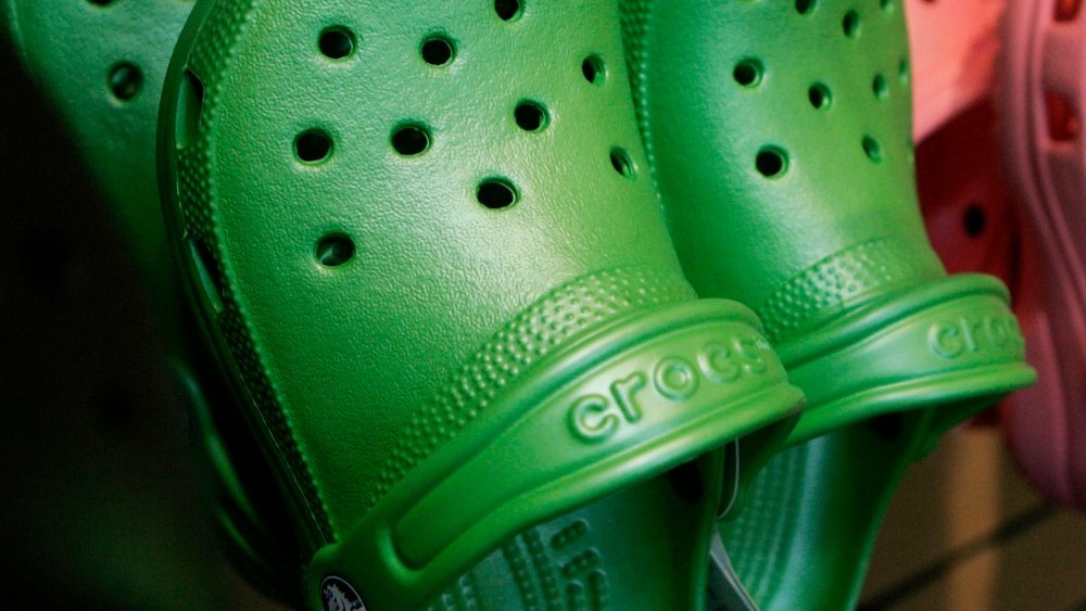 U.S.A. Dawgs agreed to pay $6 million to conclude a patent infringement case Crocs had brought against it.