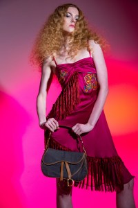 John Galliano’s dress from The RealReal. Christian Dior’s Saddle bag from Rebag