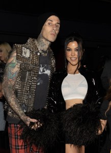 Travis Barker and Kourtney Kardashian backstage during Machine Gun Kelly: "Mainstream Sellout Tour" at the Kia Forum on July 13, 2022 in Inglewood, California.