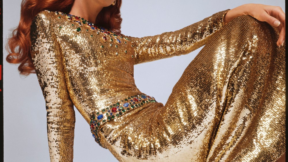A gold sequin gown from Yves Saint Laurent's fall 1966 haute couture collection photographed by David Bailey