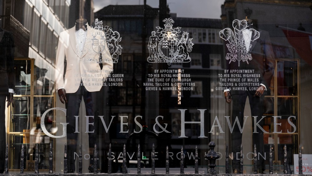 Made-to-measure suits are on display in the window of quality taylor Gieves & Hawkes on Savile Row during the third lockdown of the Coronavirus pandemic.