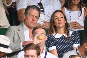 LONDON, ENGLAND - JULY 06: Hugh Grant and Anna Elisabet Eberstein at All England Lawn Tennis and Croquet Club on July 06, 2022 in London, England. (Photo by Karwai Tang/WireImage)