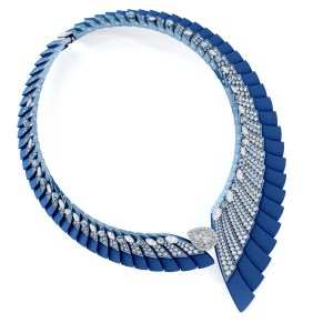 De Beers’ The Alchemist of Light Ascending Shadows necklace in white gold, dark blue aluminum and light blue titanium set with round brilliant diamonds,  marquise-shaped diamonds and blueish green rough diamonds and a fancy light gray diamond.