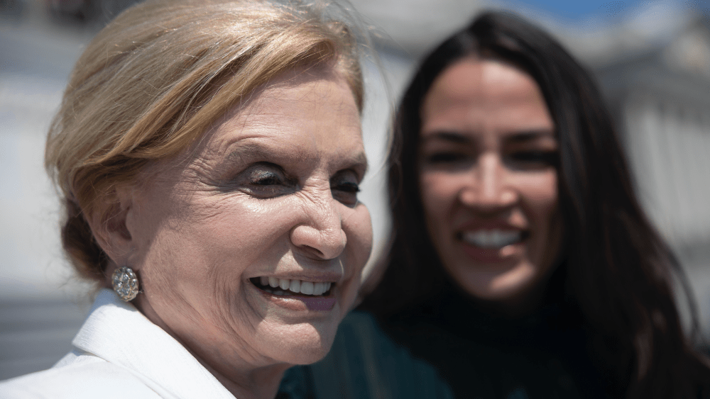 Reps. Carolyn Maloney and Alexandria Ocasio-Cortez speak to reporters outside the U.S. Capitol. Maloney is among the endorses of the federal Fabric Act.