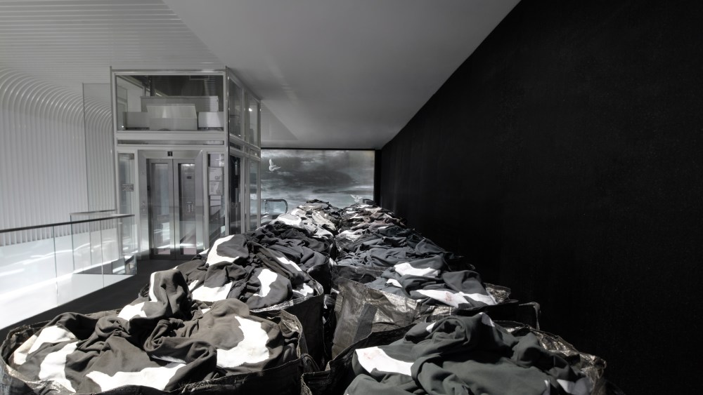An overview of the Yeezy Gap merchandise displayed in large bags at Gap Times Square.