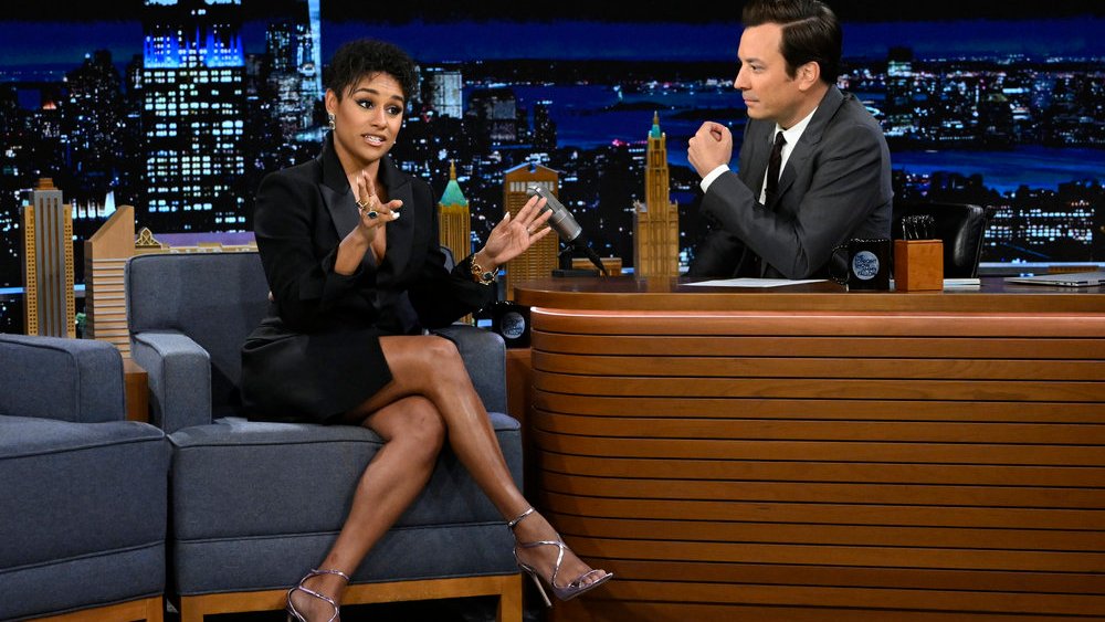 Actress Ariana DeBose wears boss little black dress and silver sandals with Tonight Show host Jimmy Fallon during the Singing Whisper Challenge on Thursday, June 30, 2022.