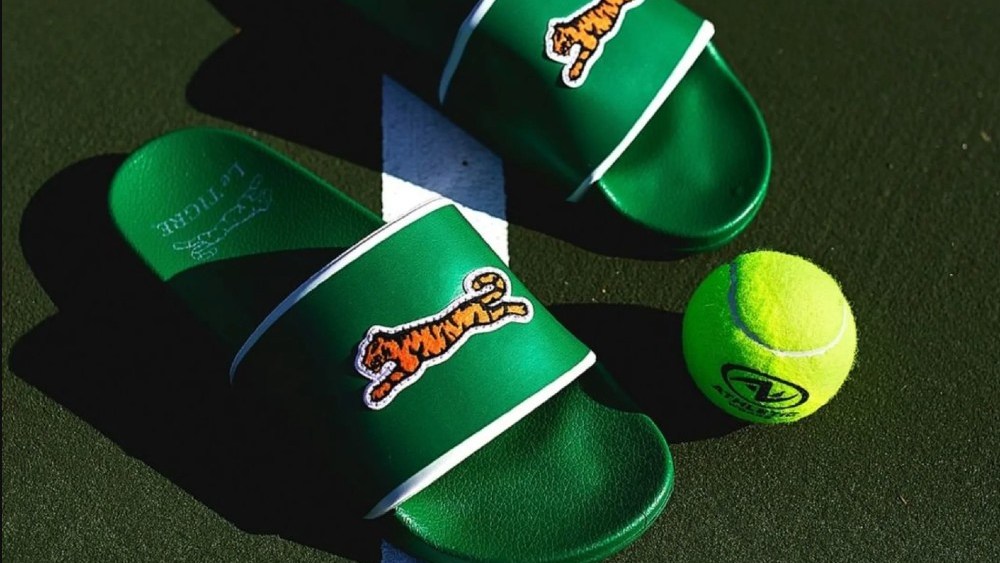 DSW owner Designer Brands Inc's licensing and distribution deal with New York's Le Tigre focuses on designing athletic sneakers and slides.