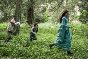 Persuasion. (L to R) Hardy Yusuf as Charles Musgrove, Jake Siame as James Musgrove, Dakota Johnson as Anne Elliot in Persuasion. Cr. Nick Wall/Netflix © 2022