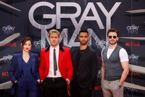(L-R) Cuban-Spanish actress Ana de Armas, Canadian actor Ryan Gosling, British actor Rege-Jean Page and US actor Chris Evans pose on the red carpet for the Special Screening of Netflixs "The Gray Man" at the Zoo Palast cinema in Berlin on July 18, 2022. (Photo by DAVID GANNON / AFP) (Photo by DAVID GANNON/AFP via Getty Images)