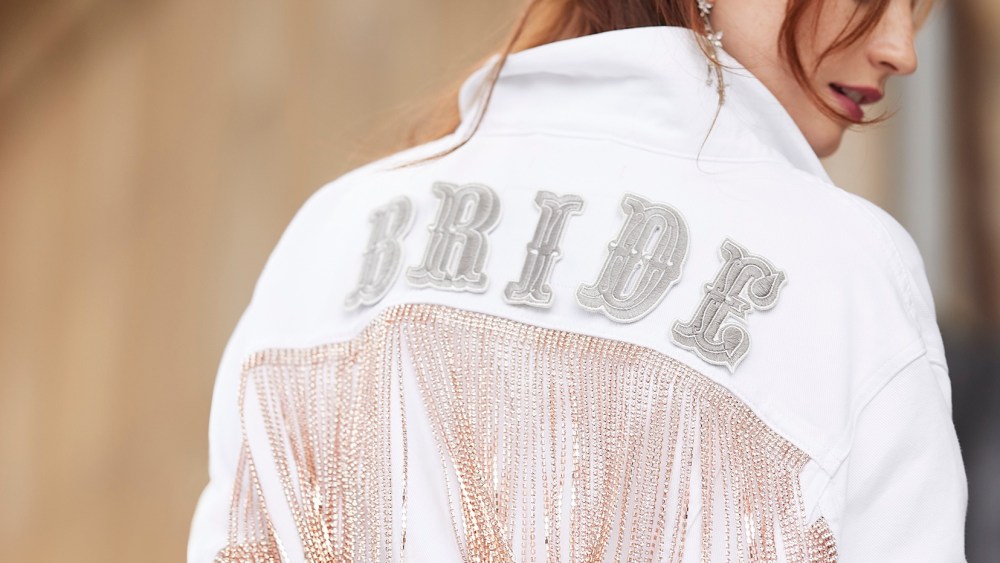 A glimpse of the collaborative David's Bridal jacket.