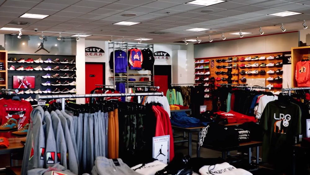 The inside of a City Gear store, one a Hibbett, Inc.'s two banners along with Hibbett Sports.