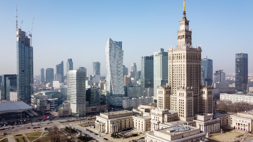 A drone view of Varso Tower (L), Zlota 44 (C) skyscrapers and Palace of Culture and Science (R) at downtown, in Warsaw, Poland on February 25