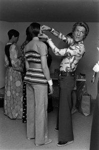 Giorgio di Sant'Angelo adjusts a models earpiece at his 4U2 Fall 1972 ready to wear collection presentation at the Guggenheim Museum in New York on,February 7, 1972.