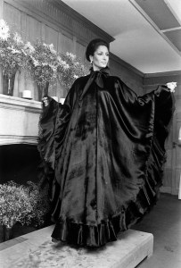 A model poses in a velvet evening poncho during  the Giorgio di Sant'Angelo resort 1974  Made-to-Order collection presentation.
