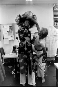 Designer Giorgio di' Sant Angelo adjusts a hat from his spring 1975 ready to wear collection on model and actress Tamara Dobson at his New York design studio.  Dobson was a muse to Sant Angelo, she is known for her role in the Black Exploitation film Cleopatra Jones.
