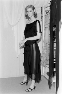 A model poses in a black layered chiffon dress from designer Giorgio di Sant Angelo's 1983 resort collection advance.