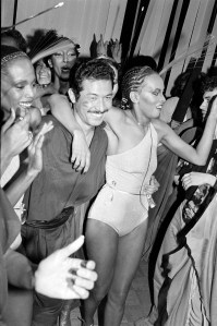 Issey Miyake and models from his "East Meets West" fashion show attend a party at Studio 54 in New York City on April 26, 1978.