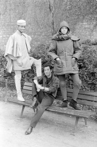 Designer Issey Miyake poses with models in the Fall RTW 1980 collection.