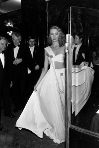 A model poses in a look designed by couturier Madame Gres before a fashion show at Maxim's Paris on December 6, 1979.