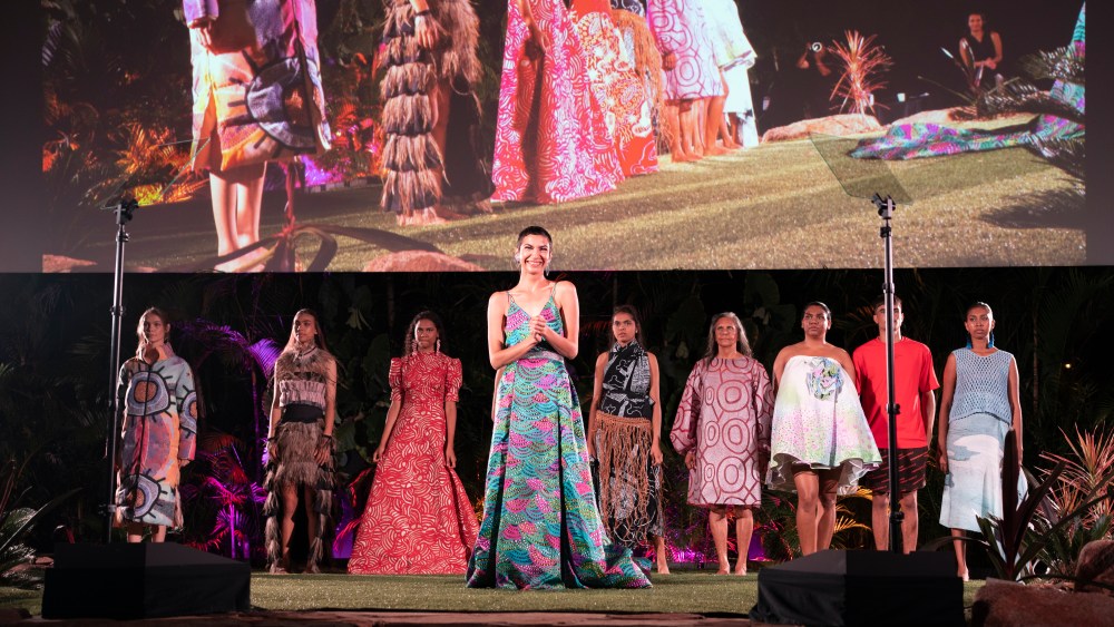 Host Rachel Hocking with models at the 2022 National Indigenous Fashion Awards presentation in Darwin, Australia