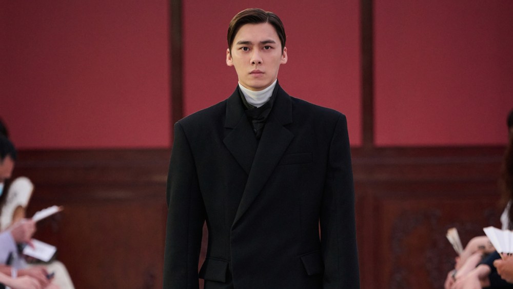 Li Yifeng walks in Prada's fall 2022 repeat show in Beijing.