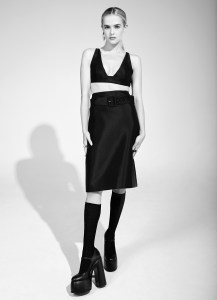Prada’s silk top, silk skirt and socks. Casadei platforms; Nikos Koulis’ 18-karat gold earrings with white diamonds and black enamel; Demarson brass rings with pavé Swarovski crystals.