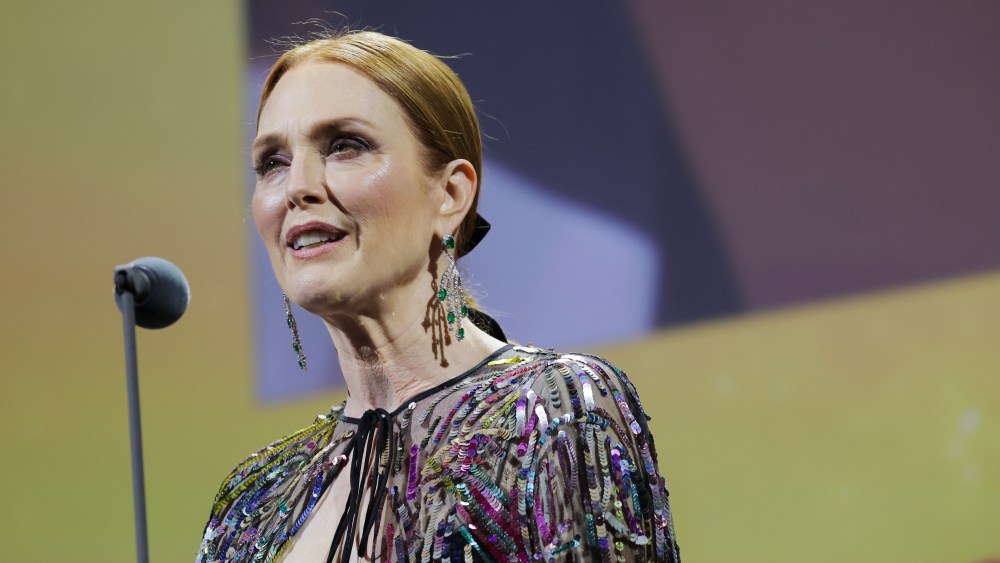Julianne Moore wearing a valentino dress speaks on stage during the opening ceremony of the 79th Venice International Film Festival on August 31, 2022 in Venice, Italy. (Photo by Victor Boyko/Getty Images)