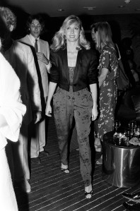 Olivia Newton-John (C) attends a party at ICE, a jewelry store in Beverly Hills, California, on August 9, 1979.